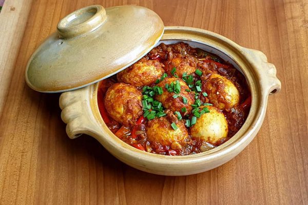 Studio maato present kinema egg curry in a custom made Donabe - Clay pot dish